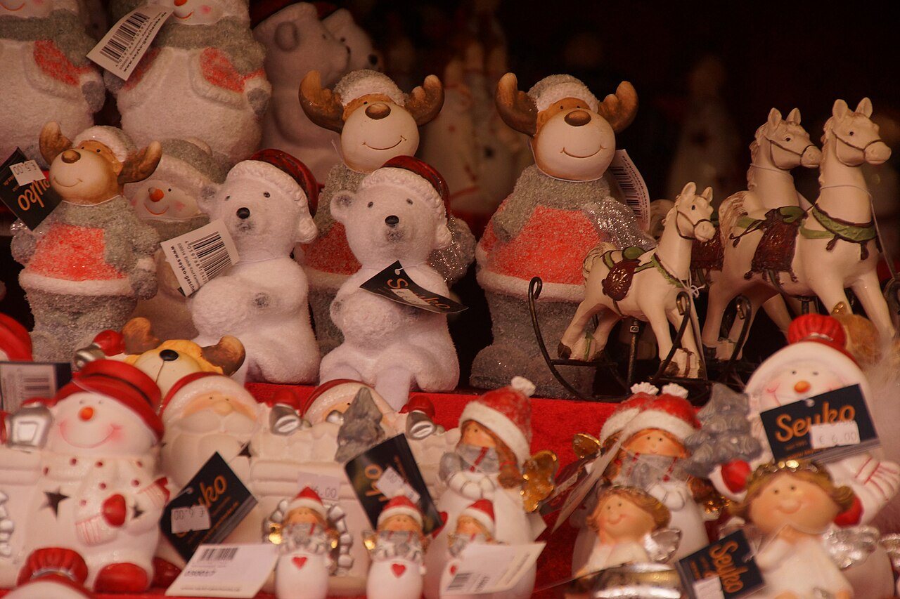 Shelves of Christmas figurines, including reindeer, polar bears, snowmen and white horses, on a stall at Nuremberg's Christkindlesmarkt